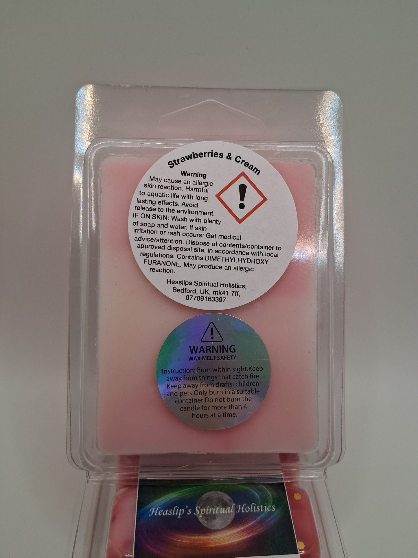 Strawberries & Cream scented 6 cavity clamshell wax melt.