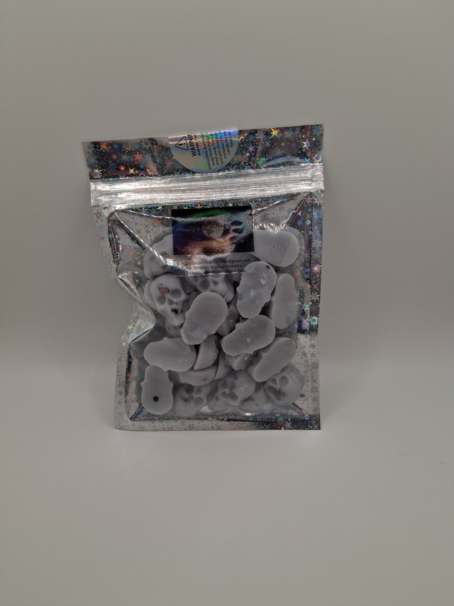 50g bag of Velvet Rose & Oud fragranced mini skull wax melts